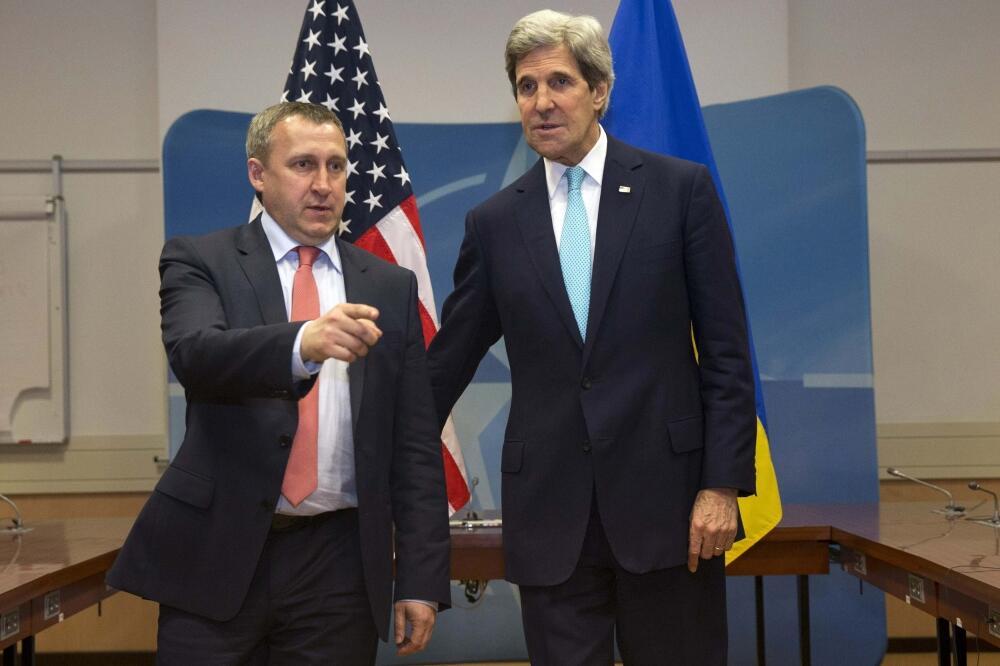 Andrij Deščitsja i Džon Keri, Foto: Reuters