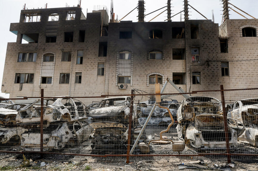 Zgrada i automobili uništeni u napadu izraelskih naseljenika u Havari, Foto: AMMAR AWAD
